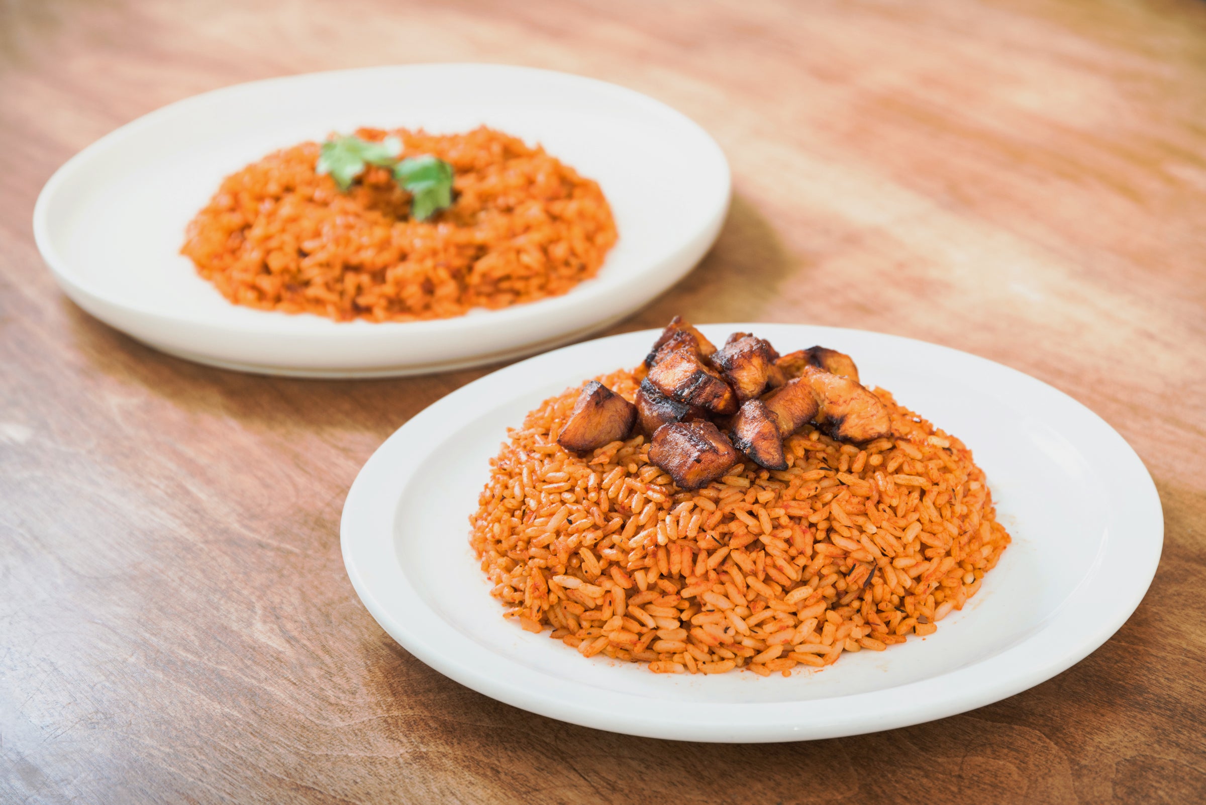 Smoky Party Jollof plated with grilled chicken