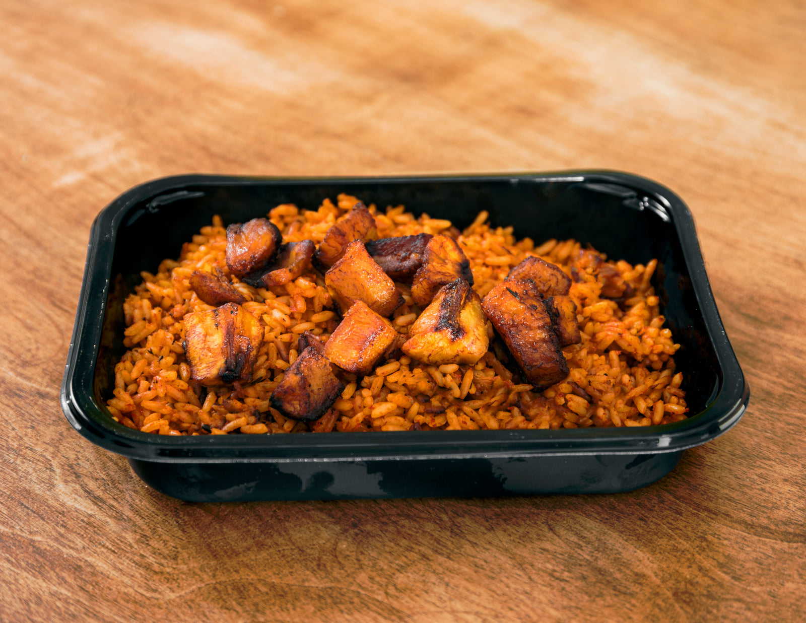 Smoky Party Jollof rice with fried ripe plantains